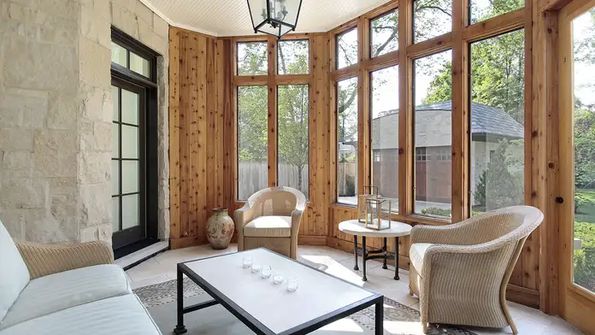 Bright sunroom with wicker chairs