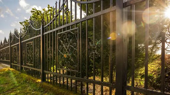 Black metal fence with ornamental details