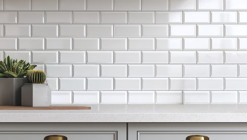 White subway tile backsplash installed behind refaced kitchen cabinets