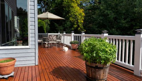 A redwood deck with patio furnitur