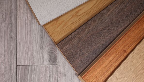Various hardwood flooring samples showing different wood grains and colors