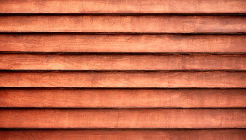 Close-up of reddish-brown horizontal wood siding
