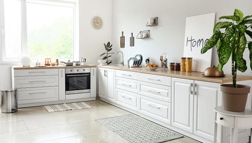 Light, airy kitchen interior with white cabinets