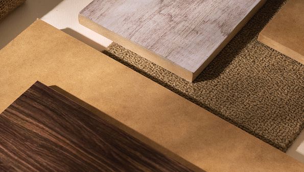 Hardwood flooring samples on textured carpet